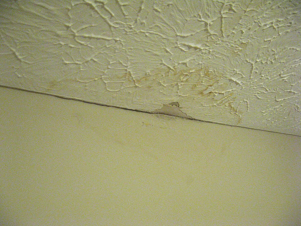 A brown ceiling stain like this means water is already inside the roof system.