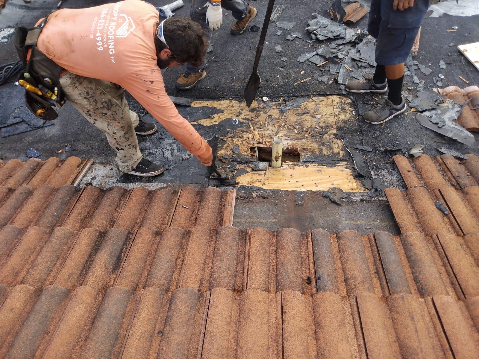 Leak at a lead stack plumbing vent on a Miami tile roof, exposed during a Canopy Roofing repair