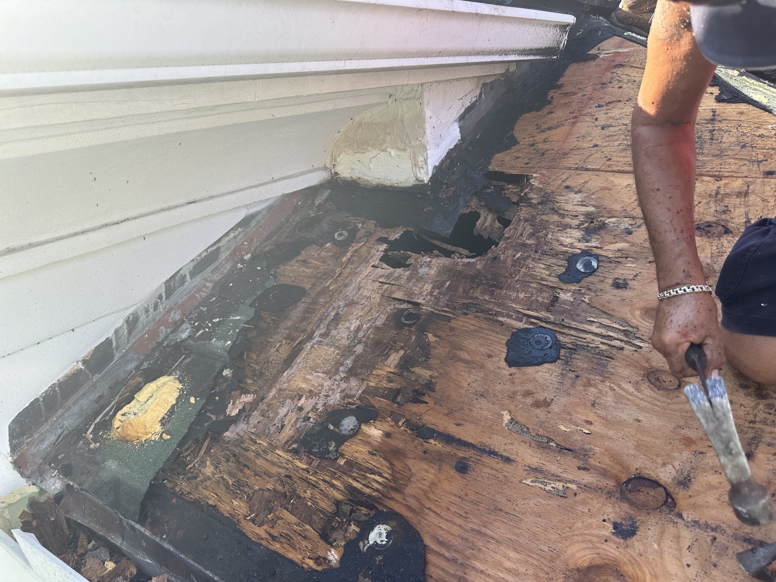Rotted roof decking at a wall flashing leak on a South Florida home